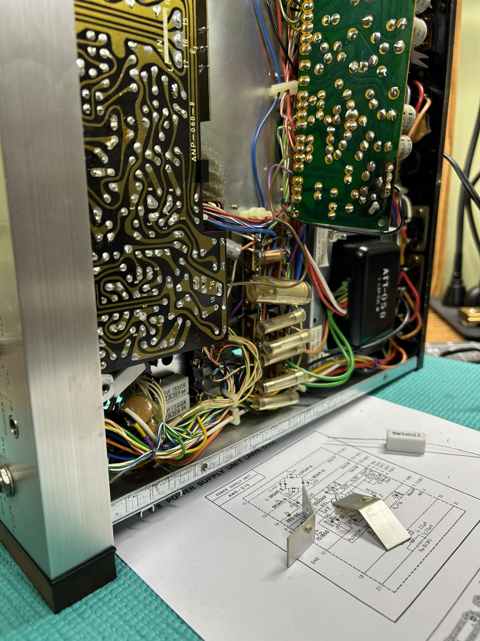 Pioneer SX-828 power-supply repair in progress with schematic and removed components